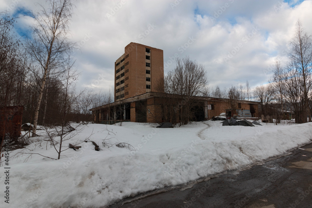 a large abandoned building on the outskirts a large abandoned building on the outskirts