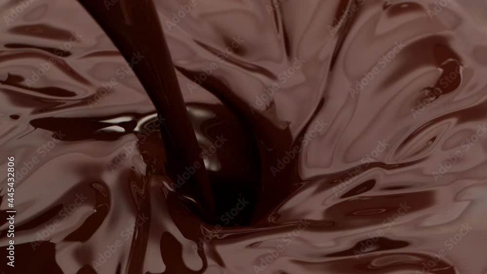 Super slow motion of dark hot chocolate pouring into twister. Filmed with high speed cinema camera, 1000fps. Super slow motion of dark hot chocolate pouring into twister. Filmed with high speed cinema camera, 1000fps.