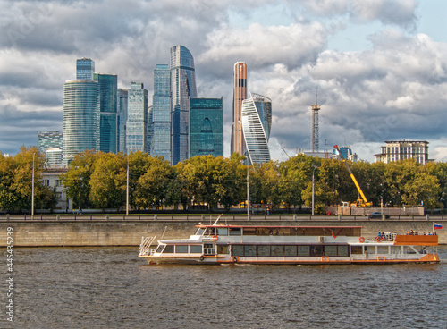 Photography Pleasure boat on the Moscow River against the background of Moscow-City