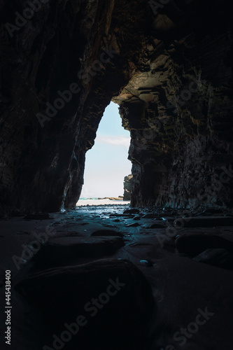 Interior of dark cave at Beach of Cathedrals photo
