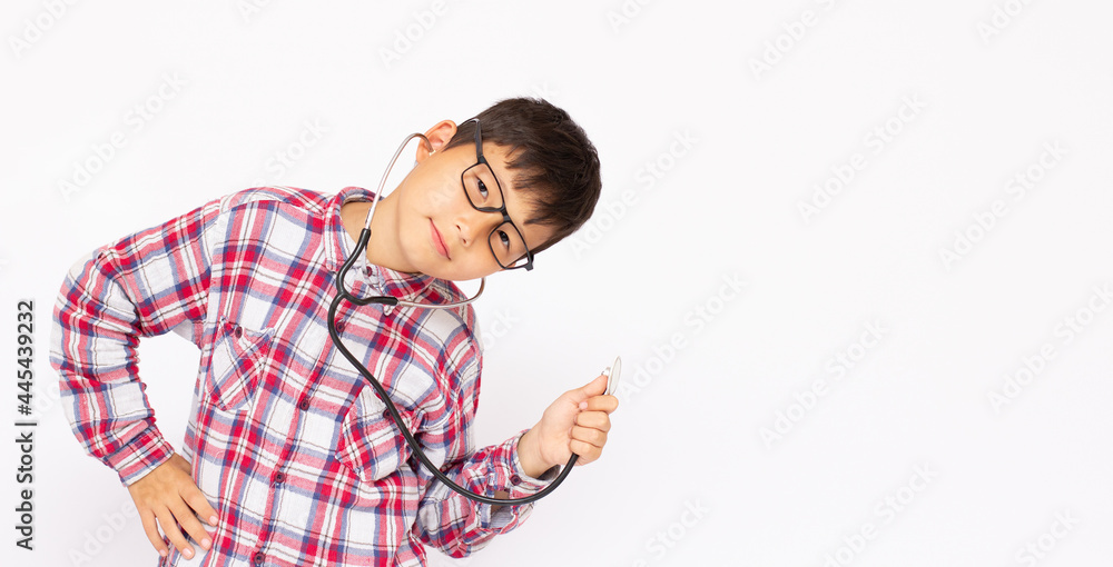 little cute boy with stethoscope playing like adult profession doctor close up isolated on white adorable kid copy space little cute boy with stethoscope playing like adult profession doctor close up isolated on white adorable kid copy space