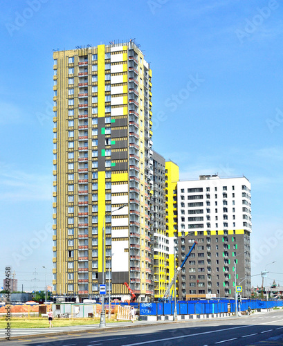 Construction of a multi-section building with floors of different levels photo