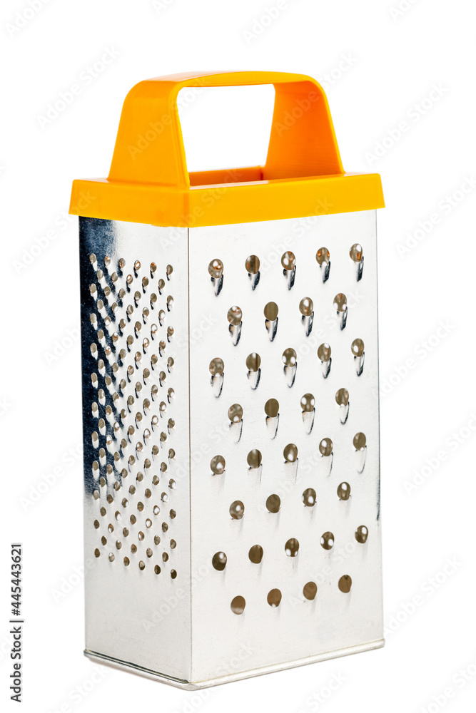 Vegetable grater on a white isolated background. Kitchen grater close-up Vegetable grater on a white isolated background. Kitchen grater close-up