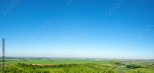 Panorama of meadows  fields and the small town of Rohatyn on a sunny day in summer in Ukraine