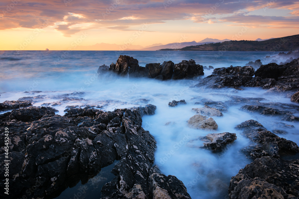 Obraz premium Sunset seascape of picturesque rocks on the coast of Albania