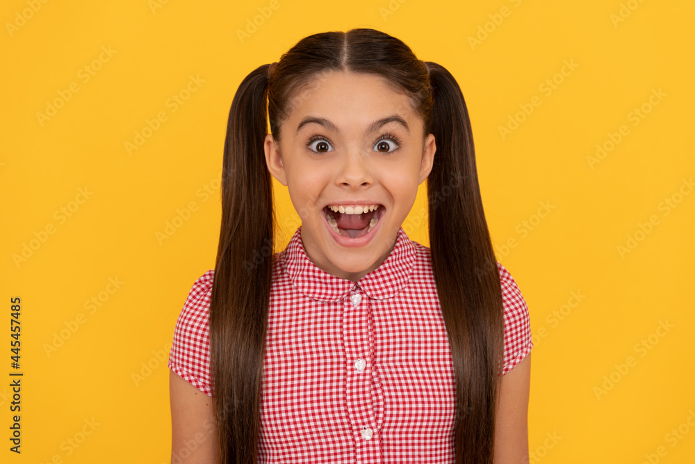 What a pleasant surprise. Girl keep mouth open with surprise. Surprised kid yellow background What a pleasant surprise. Girl keep mouth open with surprise. Surprised kid yellow background