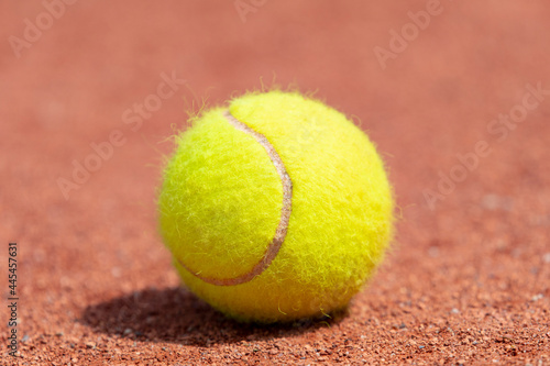 Tennis ball on a tennis clay court. Professional sport concept © Augustas Cetkauskas