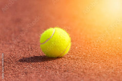 Tennis ball on a tennis clay court. Professional sport concept
