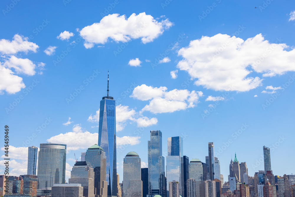Unique shape clouds float over the Lower Manhattan skyscraper in springtime at New York City NY USA on May 14 2021. Image was taken from Jersey City NJ. Unique shape clouds float over the Lower Manhattan skyscraper in springtime at New York City NY USA on May 14 2021. Image was taken from Jersey City NJ.