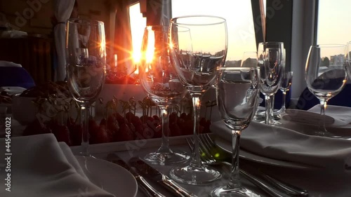 Served restaurant table on the ship at sunset. Service for tourists on the liner.