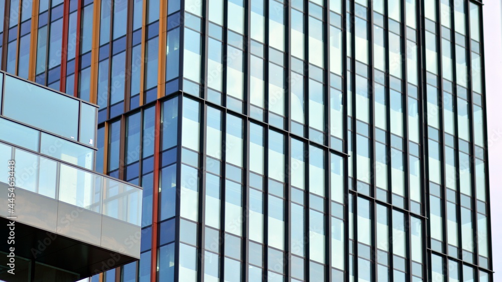 Eco architecture. Green tree and glass office building. The harmony of nature and modernity. Reflection of modern commercial building on glass with sunlight. Eco architecture. Green tree and glass office building. The harmony of nature and modernity. Reflection of modern commercial building on glass with sunlight.