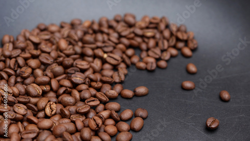 a path of coffee beans on a black background