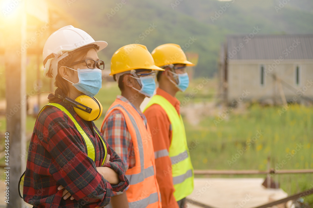 Workers wear a quarantine face mask. Workers wear a quarantine face mask.