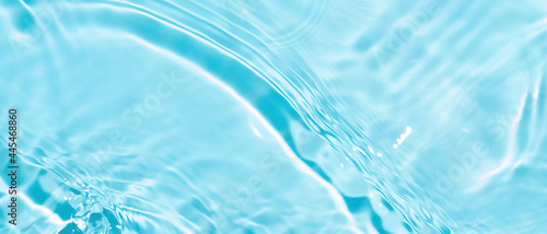 Blurry transparent blue colors transparent calm water surface texture. Trendy abstract nature background Water waves with copy space.