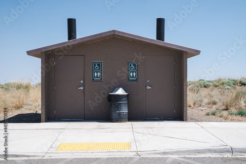 Pit toilets with two stalls at a rest area in Benton County Washington, a rural area photo