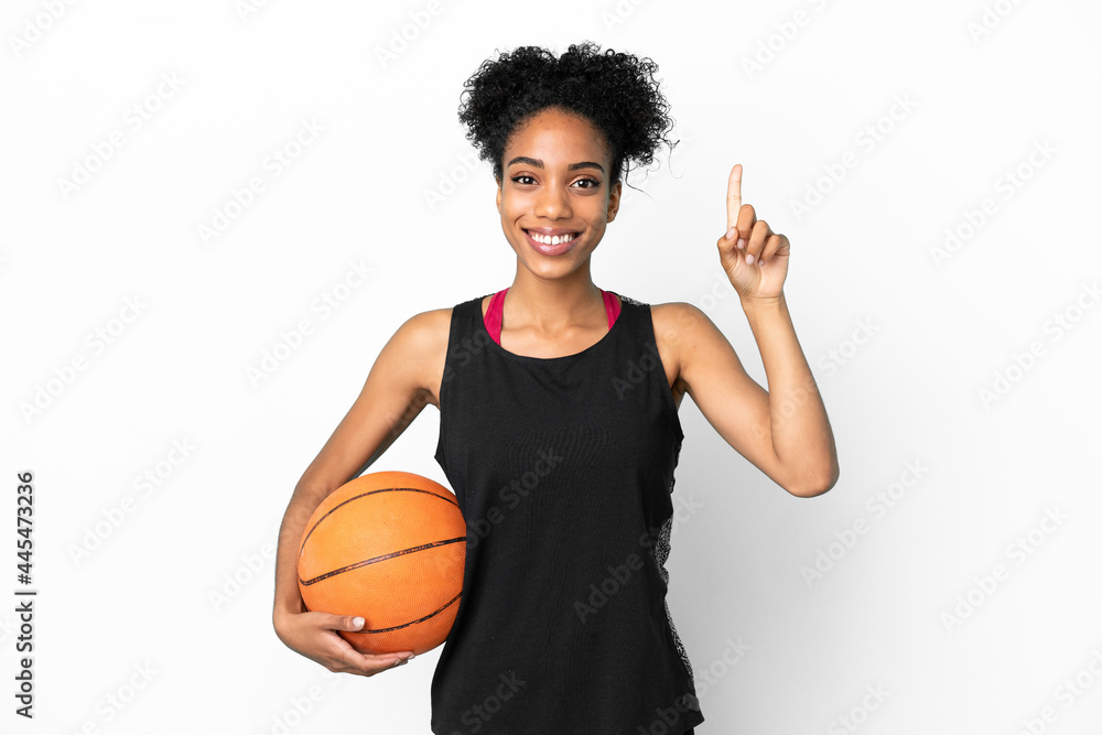 Young basketball player latin woman isolated on white background pointing up a great idea
