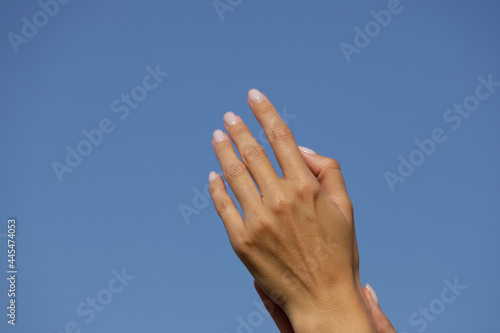 hands on sky background. Life. Lifestyle. Woman hand. Photo. 