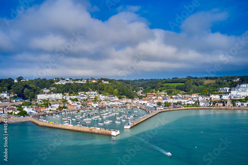 Aerial drone image of St Aubn's Harbour and Village at high tide in the sunshine. Jersey Channel Islands