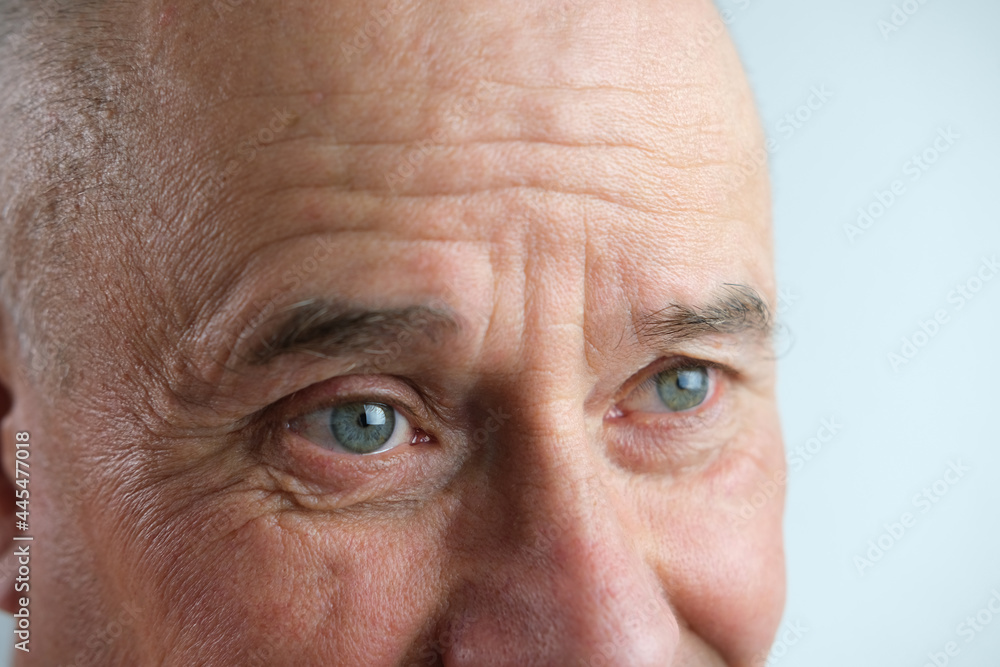 close-up of face old man, senior with deep wrinkles, cheerful gray eyes laugh, concept human emotion, meet old age with dignity close-up of face old man, senior with deep wrinkles, cheerful gray eyes laugh, concept human emotion, meet old age with dignity