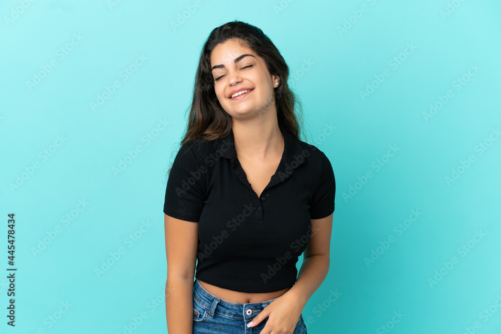 Young caucasian woman isolated on blue background laughing Young caucasian woman isolated on blue background laughing
