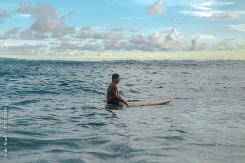 calm surfer waiting for a wave in the sea © Tonatiuh