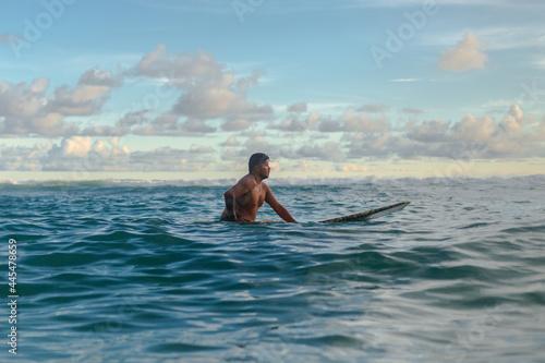 surfer on his board waiting in the sea