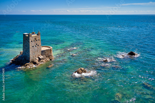 Aerial drone image of Seymour Tower at high tide in the sunshine. Jersey Channel Islands.