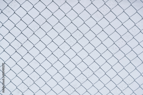 frozen mesh fence close-up