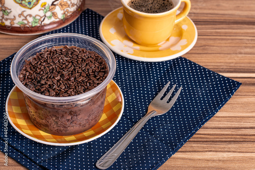 cake in brigadeiro pot on wooden background