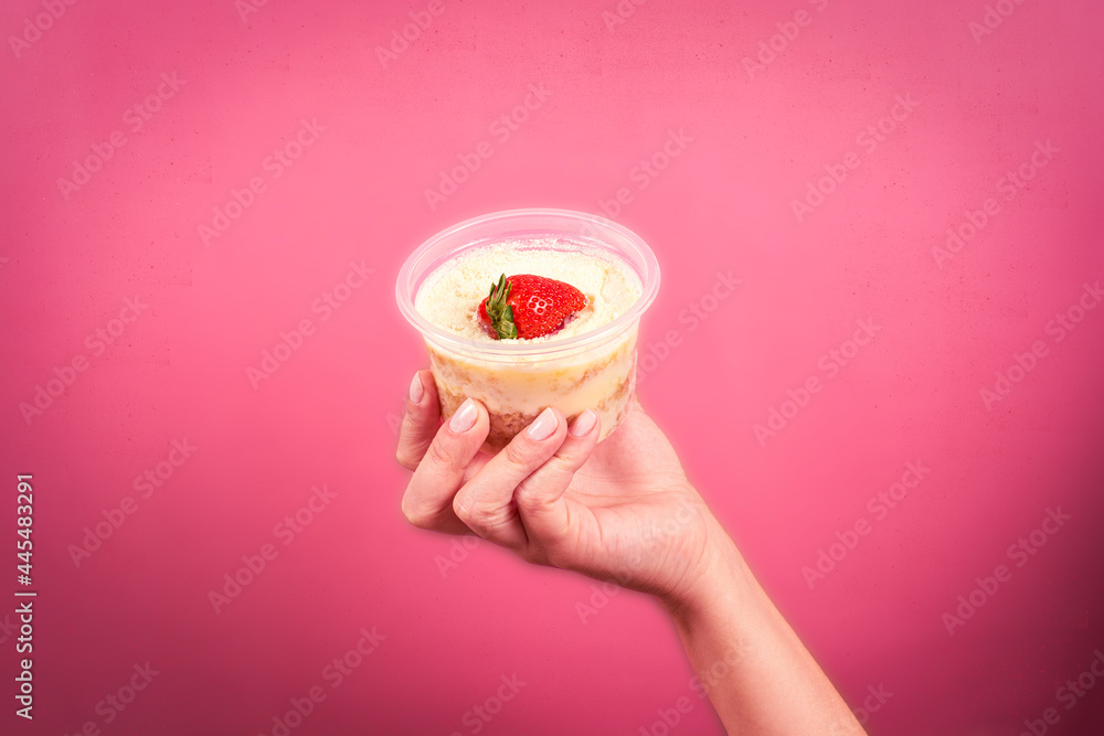strawberry pot cake with milk nest on pink background strawberry pot cake with milk nest on pink background