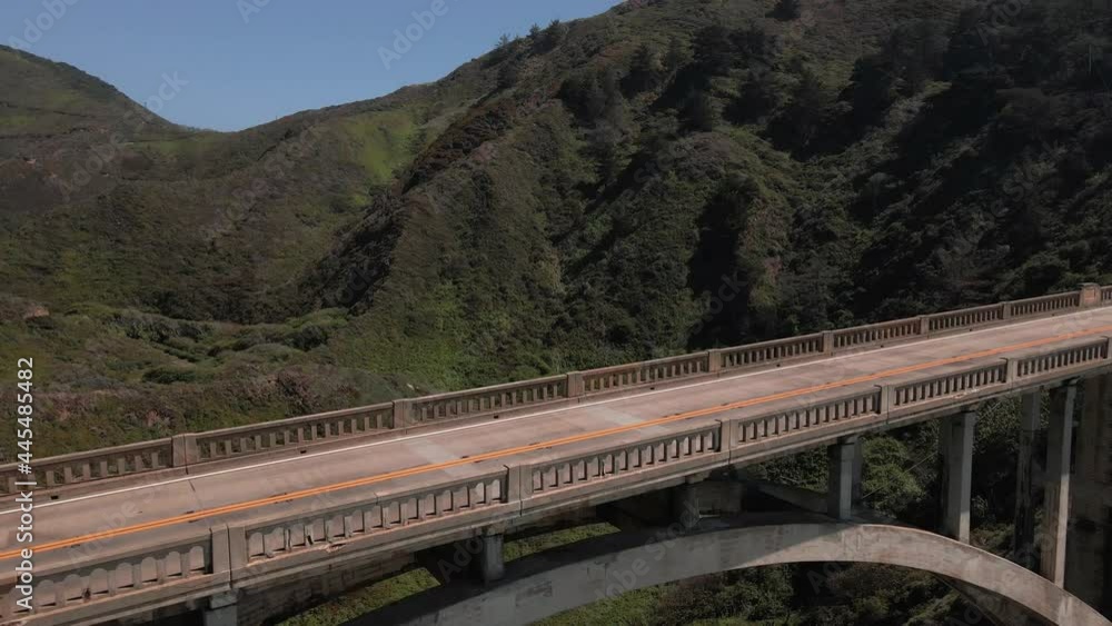 Bixby Creek Bridge, Big Sur, California USA. Revealing Pull Back Close Up Aerial View of Empty Deserted Landmark and Landscape, Drone Shot Bixby Creek Bridge, Big Sur, California USA. Revealing Pull Back Close Up Aerial View of Empty Deserted Landmark and Landscape, Drone Shot