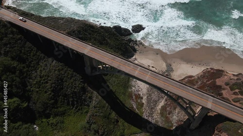 Birdseye Aerial View of Traffic on Bixby Creek Bridge, Big Sur, California USA. Top Down Revealing Drone Shot