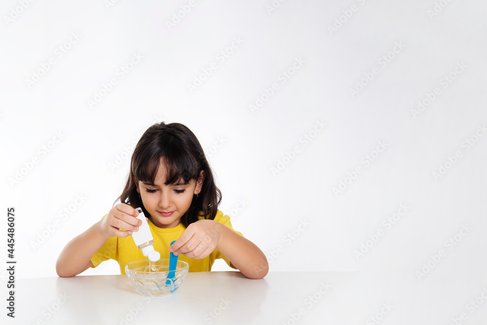 girl in yellow with slime on white background. girl in yellow with slime on white background.