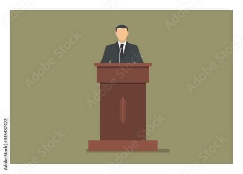 A man standing and giving speech on a podium 
 photo
