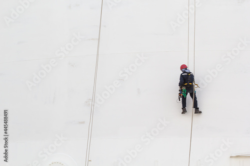 Male worker rope access inspection of thickness storage tank industry