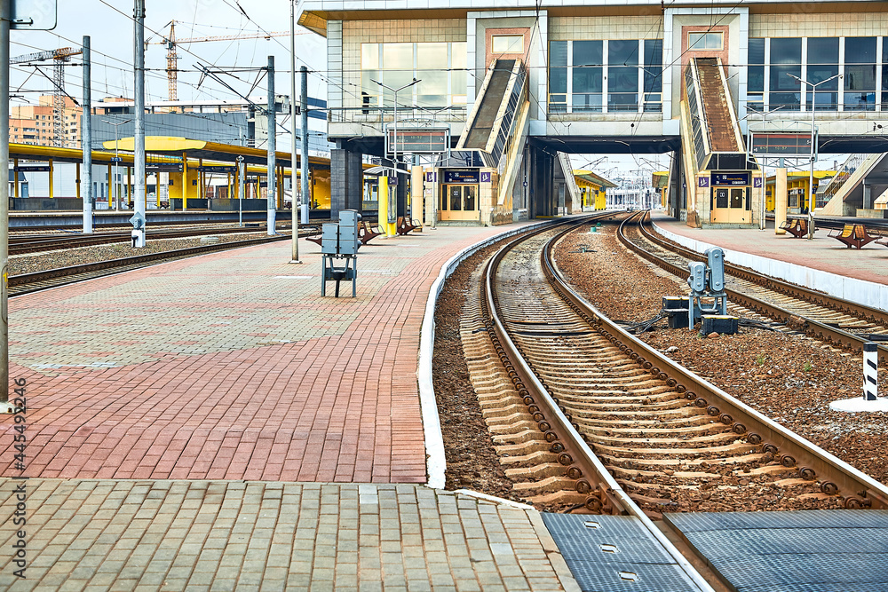 Rails and sleepers. Platform for boarding passengers on long-distance trains.
