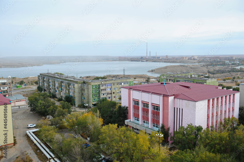 Zhezkazgan, Kazakhtan - 10.10.2016 : Residential buildings, commercial buildings and courtyards along the central streets of the city. Zhezkazgan, Kazakhtan - 10.10.2016 : Residential buildings, commercial buildings and courtyards along the central streets of the city.