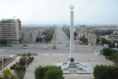 Zhezkazgan, Kazakhtan - 10.10.2016 : A stele with state symbols in the central part of the city photo