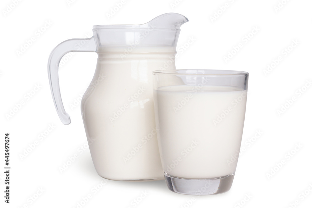 Natural whole milk in a jug and a glass isolated on a white background. Natural whole milk in a jug and a glass isolated on a white background.