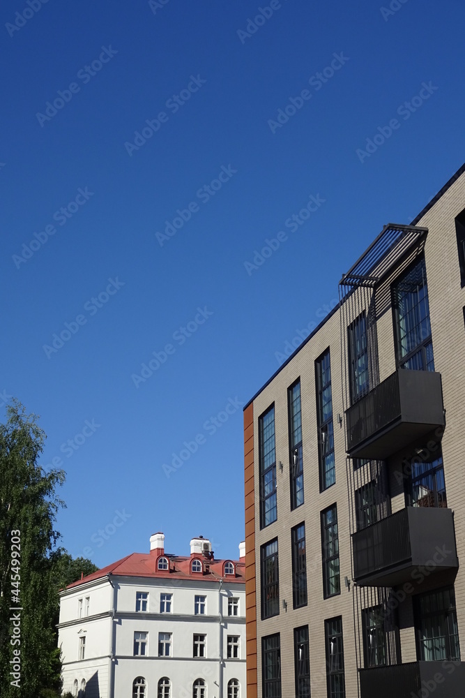 Modern new houses, buildings in Kalamaja district. Cloudless sunny day with clear blue sky. Summertime, July. Tallinn, Estonia, EU