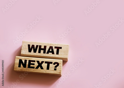 Words What Next on wooden blocks. Next steps concept for business or medicare