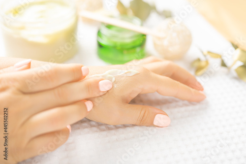Hand Skin Care. Closeup soft Female Hands With Natural Manicure Nails. Close Up Of Woman s Hand Touching Her Soft Silky Healthy Skin. Beauty And Health  selective focus