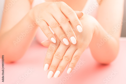 middle aged Female Palm. Beautiful Glamour Manicure. Care about Hands and Nails  clean Skin. Professional manicure in beauty salon. Hygiene and care for hands. Beauty industry concept.