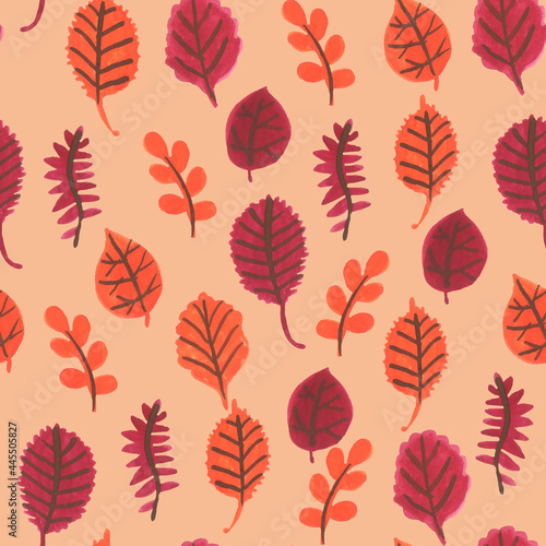 Seamless pattern with autumn leaves on beige background