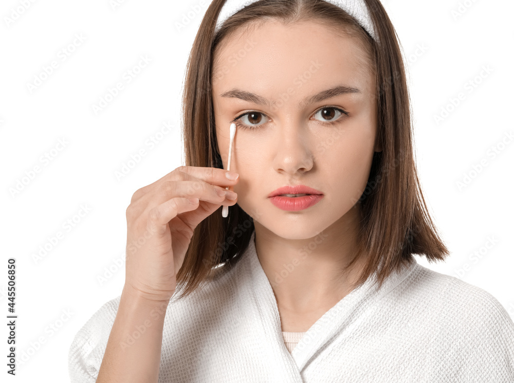 Young woman with cotton bud on white background Young woman with cotton bud on white background