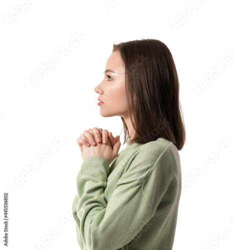 Religious young woman prayi...