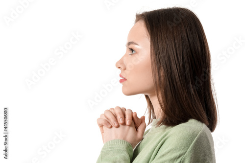 Religious young woman prayi...