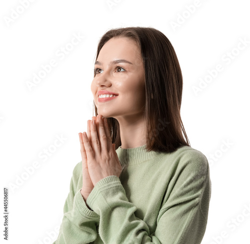 Religious young woman prayi...