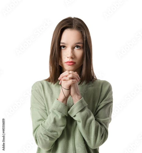 Religious young woman prayi...