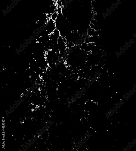 Splashes and drops of water are on a black background.